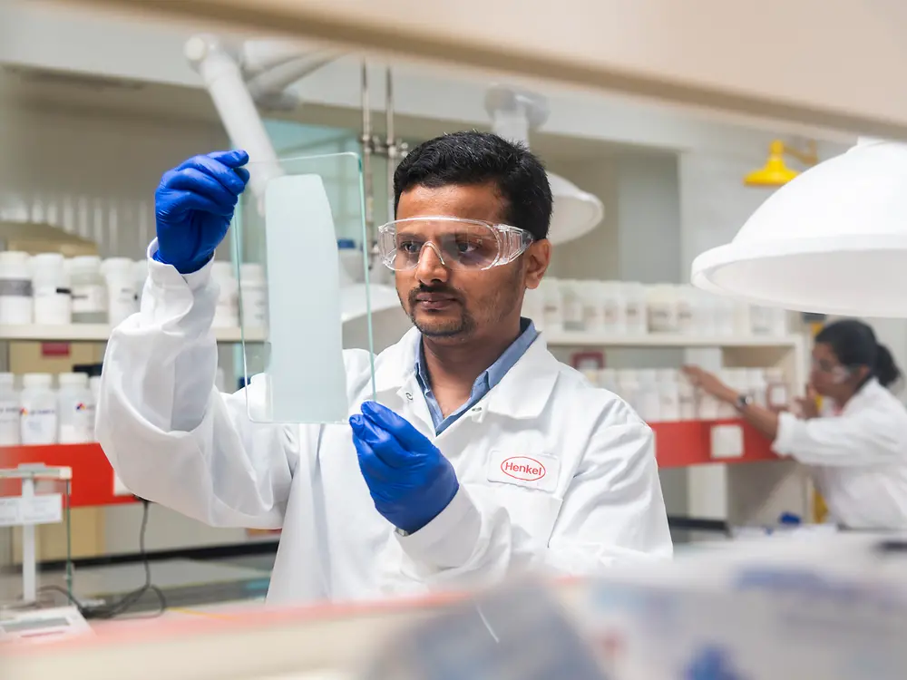 A laboratory employee concentrates on his work in a laboratory at the Technology Center Mumbai development center.